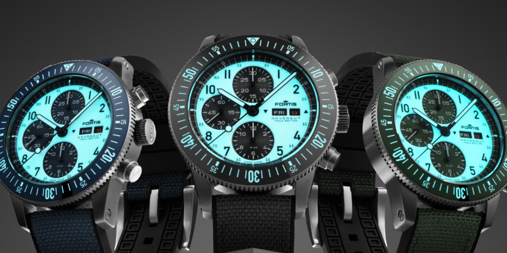 Three Novonaut Halo chronographs glowing in the dark